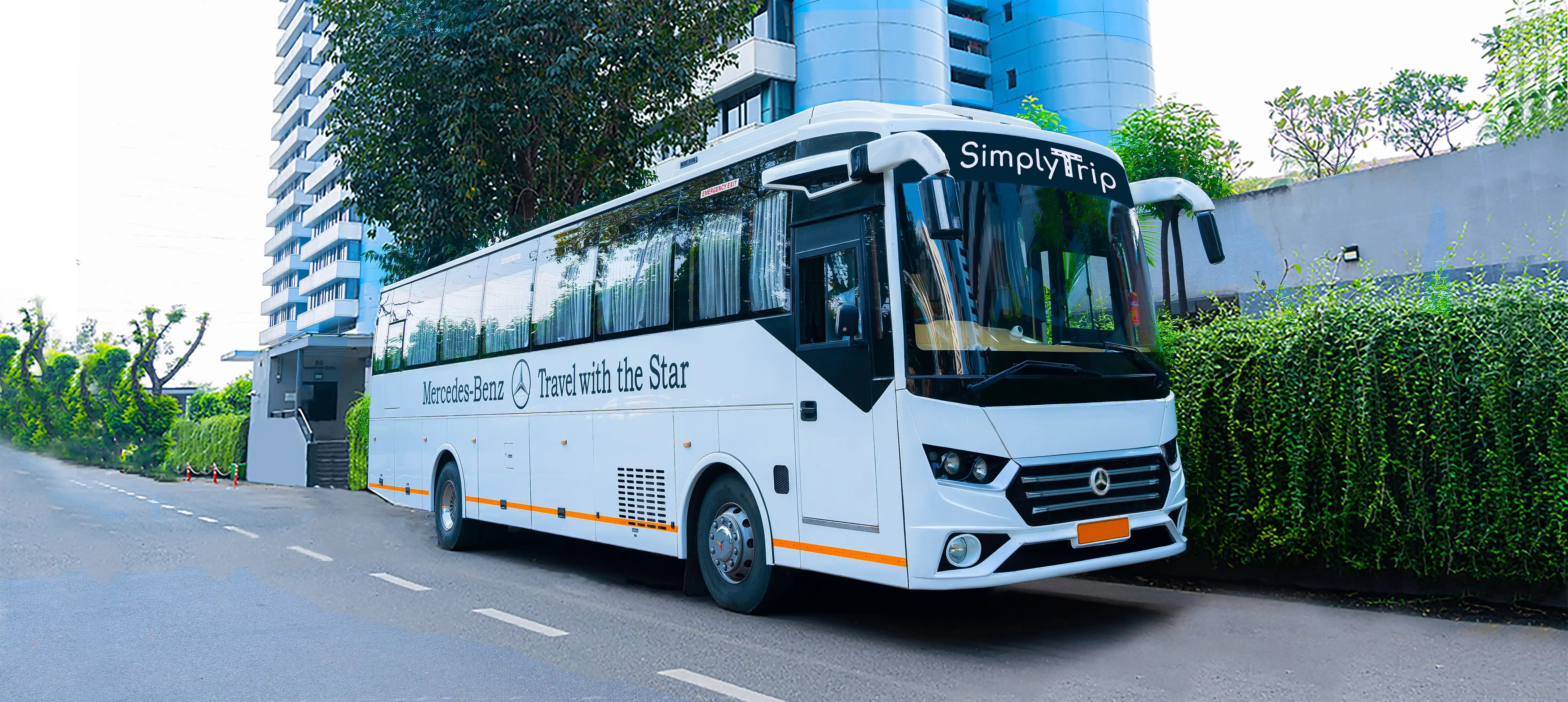 A white SML executive minibus on rent with sealed windows & white wheelcaps